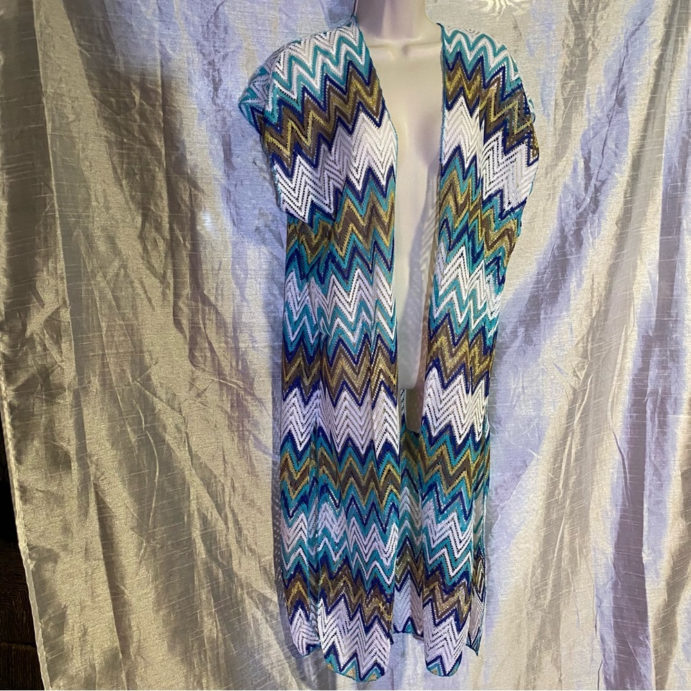 Long Lacy vest style beach cover up,easy to pack,lots of coverage. Pretty colors